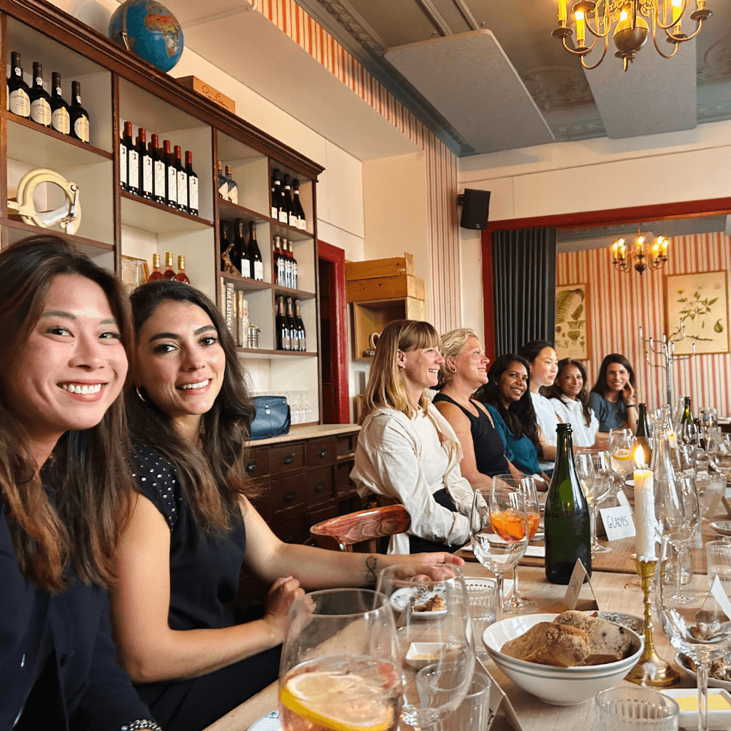 Women having intimate conversation over dinner